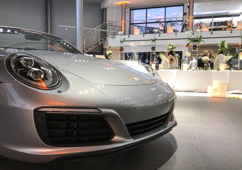 Illustration for article titled This Couple Topped Your Wildest Dreams By Getting Married In A Porsche Showroom